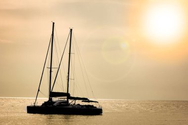 beautiful yacht sailing in the sea silhouette background