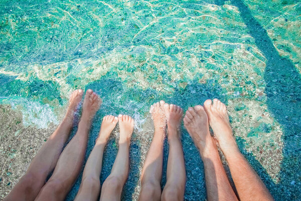 beautiful legs on the sand by the sea