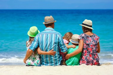 Happy family with children on the coast of the sea travel