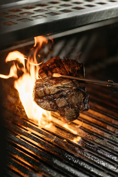 Stock image Beef T-bone steak grilled on open fire