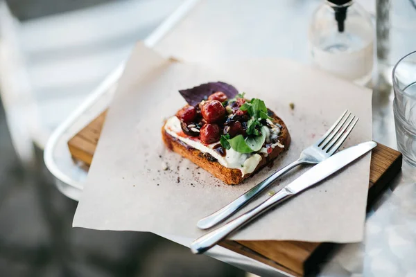 stock image Set of bruschetta with fish, meat and vegetables served on the restaurant table 