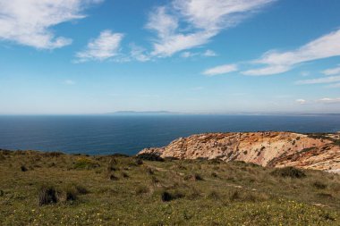 sea view of blue coastline at Sesimbra, Portugal  clipart