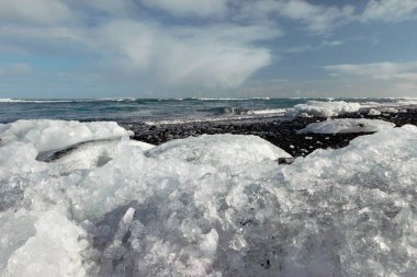 ice blocks on black diamond beach in Iceland  clipart