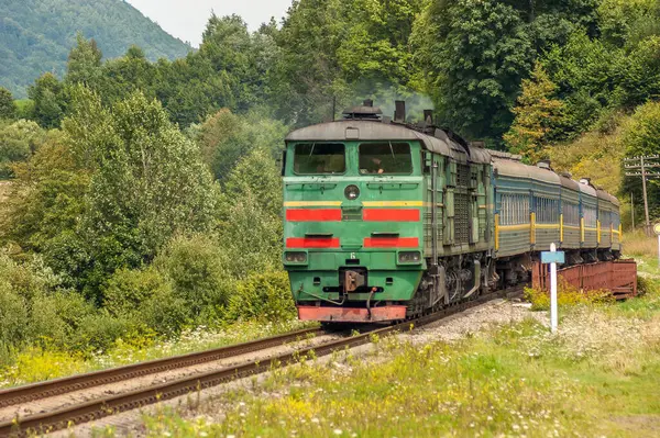 Diesel locomotive on bridge over canyon