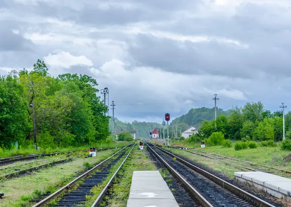 Old railway tracks running out of station