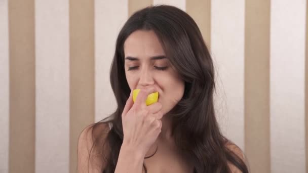 Portrait Young Caucasian Woman She Enjoys Eating Yellow Sour Lemon — Stockvideo
