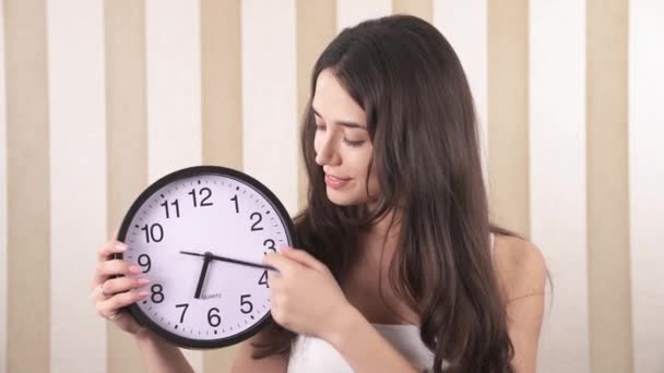 Close Smiling Girl Girl Holding Wall Clock Her Hands One — Vídeo de Stock