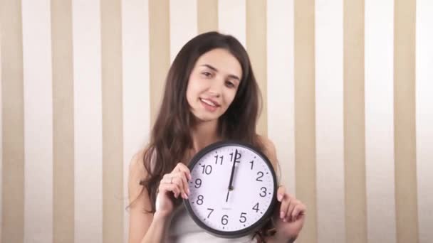 Close Smiling Happy Girl She Twists Wall Clock Her Hands — Vídeo de Stock