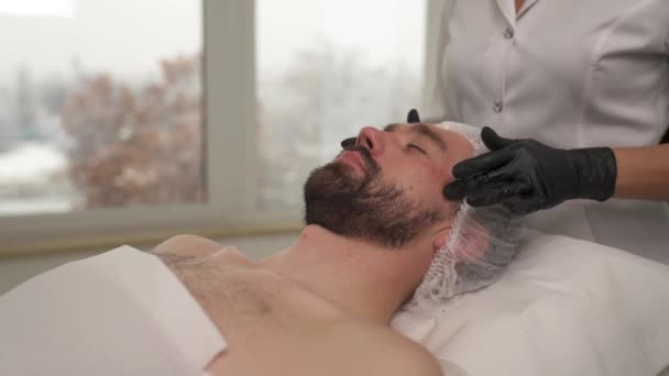 Close Man Face Woman Hands Black Gloves Massaging His Forehead — Stock Video
