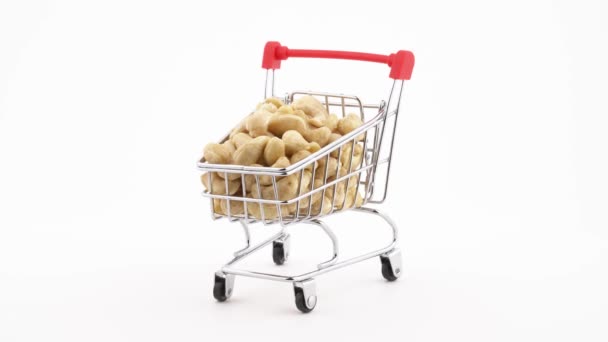 Shopping Cart Filled Cashew Nuts Rotating Turntable Isolated White Background — Vídeos de Stock