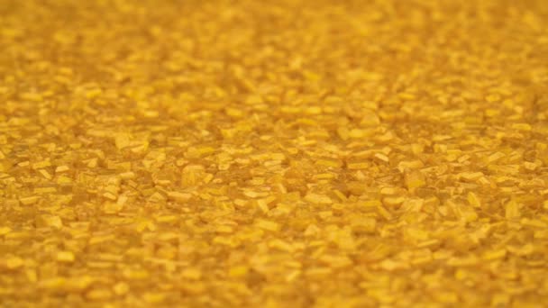Small Gold Bar Shaped Crystals Pile Rotating — Vídeo de stock