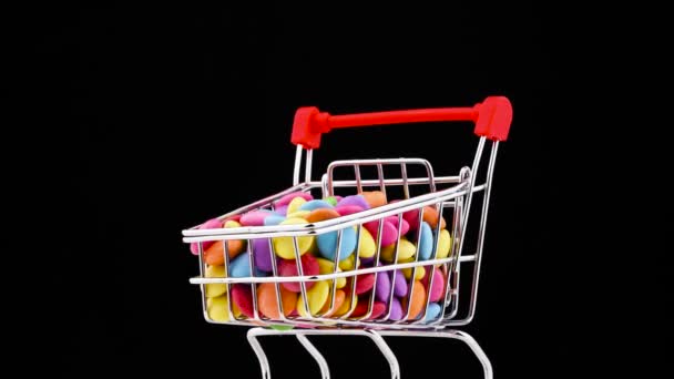 Close Supermarket Trolley Filled Colorful Sweet Chocolate Candies Rotating Turntable — Stockvideo