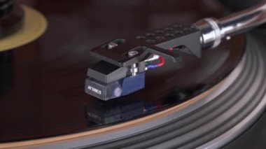 Close-up of a vinyl rotating on a turntable. Tone arm with coil is moving to LP vinyl record start playing a song.