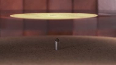 Close-up of a vinyl record putting to LP vinyl record player.