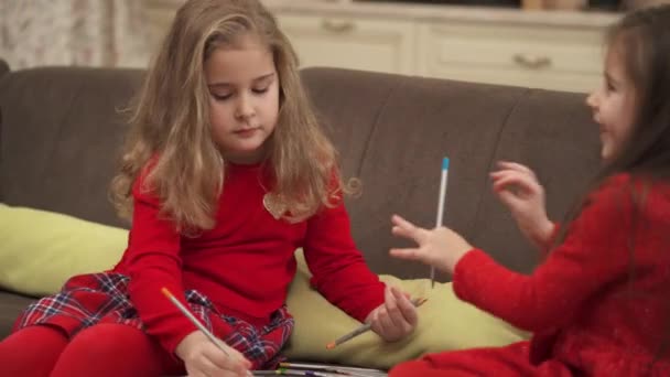 Two Cute Little Girls Sitting Couch Drawing Colored Pencils — Stockvideo
