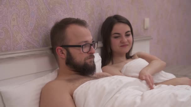 Young Couple Having Problems Bed Girl Lifts Blanket Looks Disappointment — Stockvideo