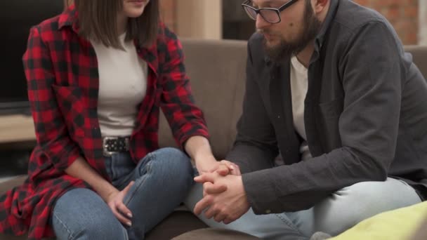 Young Bearded Man Glasses Upset Disappointed Sitting Sofa His Girlfriend – Stock-video