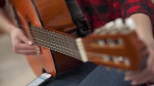 Close View Woman Touches Tuning Keys Tries Tune Acoustic Guitar — Stockvideo