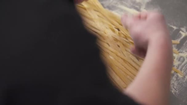 Hands Holding Bunch Cut Noodles Table Spreading Them Table Flour — Vídeos de Stock
