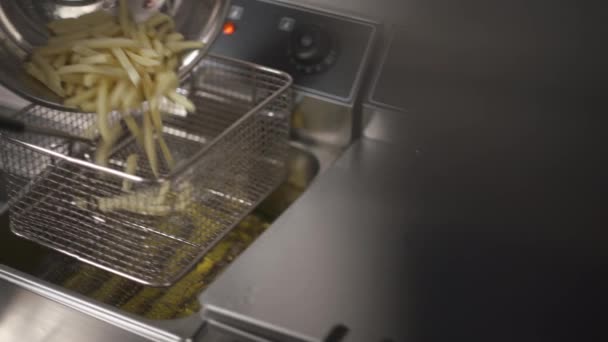 Close Deep Fryer Basket Hand Puts Slices Potatoes Puts Basket — Video Stock