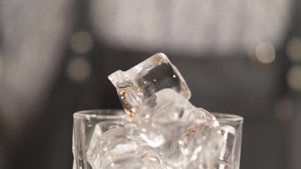 Close Drinking Glass Ice Cubes Pipette Dropping Brown Liquid Cocktail — Vídeos de Stock