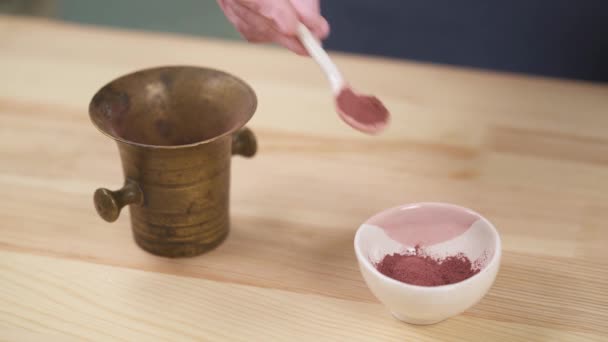 Girl Spoon Puts Organic Flower Powder Copper Mortar Ceramic Bowl — Vídeos de Stock