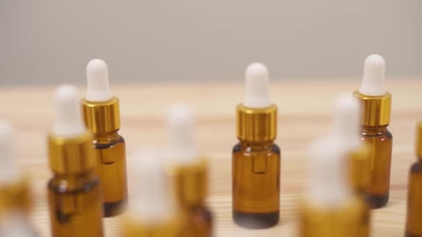 Close Dolly Shot Passing Small Amber Bottles White Caps Wooden — Stok Video