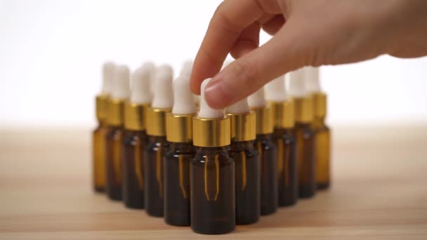 Close Front View Woman Hand Putting Small Amber Bottle White — Vídeo de Stock