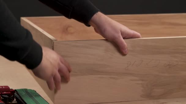 Side View Carpenter Joining Work Pieces Nail Gun Make Drawer — Stockvideo