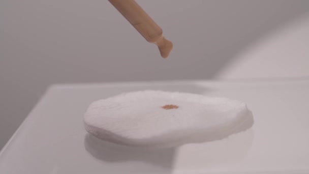 Closeup Drops Tonal Cream Falling Cotton Pads White Background — Stok video