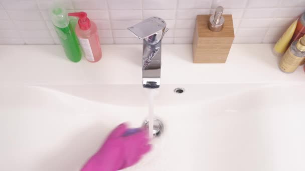 Top View Woman Hand Pink Glove Cleaning Bathroom Sink Purple — стоковое видео