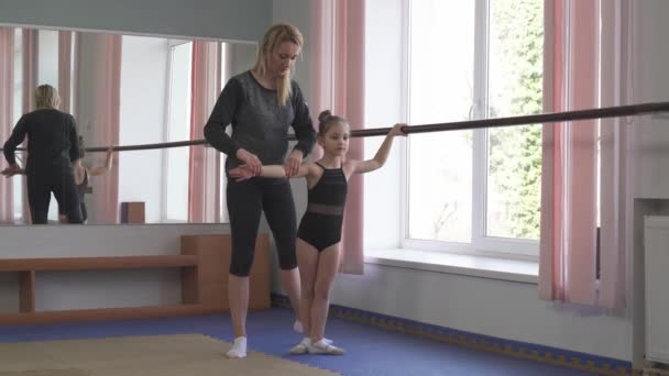 Young Gymnast Practicing Exercises Wall Mounted Ballet Barre Instructor Control — Stock Video