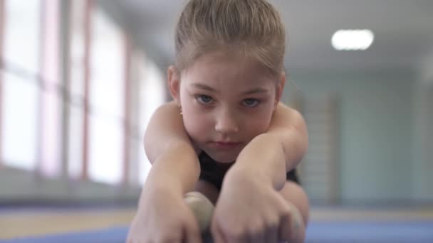 Close View Little Female Gymnast Doing Stretching Exercises Sitting Pike — Wideo stockowe