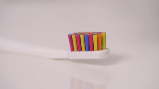 Close Blue Tooth Paste Pouring Colorful Tooth Brush — Vídeo de Stock