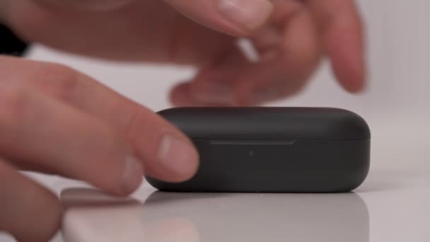 Black Wireless Headphones Isolated White Background Male Hand Taking Wireless — Stock video