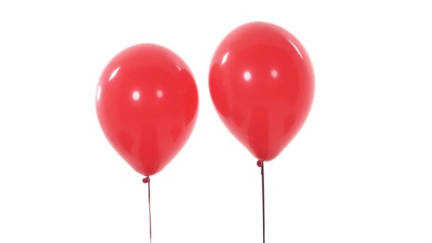 两个红色气球相互接近 爱情的象征孤立无援 背景为白色 礼物的概念 — 图库视频影像