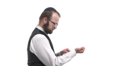 Side view of handsome Jewish man showing middle finger. Guy demonstrating fuck you sign, offensive gesture. Isolated, on white background