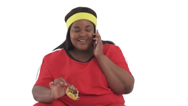 Close Portrait African American Woman Overweight Sportswear Eating Donut Talking — Stock Video