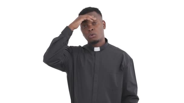 Portrait African Young Priest Wiping His Forehead Hand Demonstrating Emotion — Stock Video