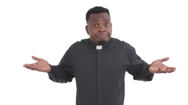 Portrait Black Puzzled Priest Arms Hands Raised Shrugging His Shoulders — Stock Video
