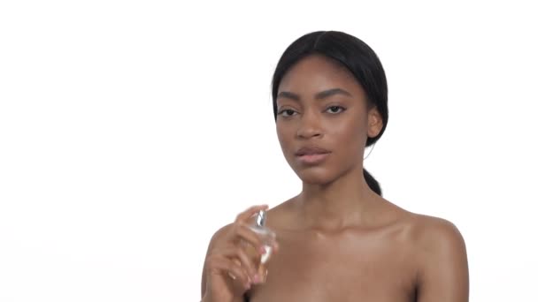 Attractive Young African Woman Spraying Perfume Her Body Isolated White — Stock Video