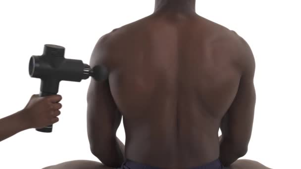 Close Therapist Treating Injured Back Muscles Triceps Male African Athlete — Stock Video