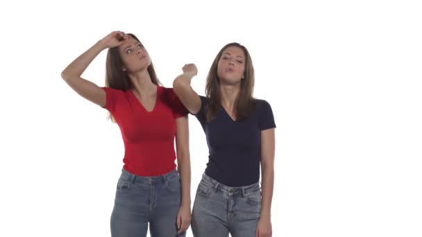 Caucasian Twin Sisters Suffering Heat Fanning Themselves Hands Wiping Sweat — Stock Video
