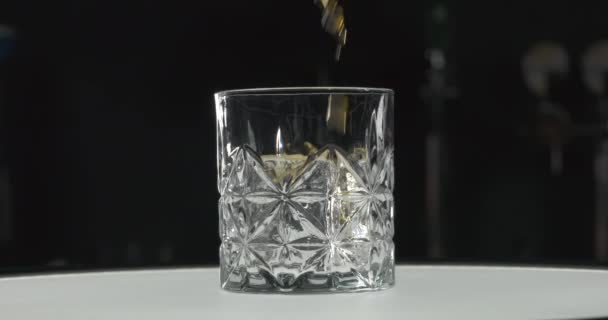 Alcohol Drink Pouring Rocks Glass Golden Whiskey Goblet Floats Alcoholic — Stock Video