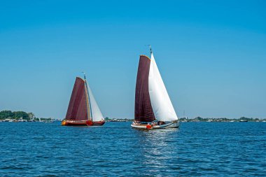 Traditional Frisian wooden sailing ships in a yearly competition in the Netherlands