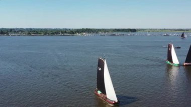 Competition from skutsjessilen on the Sneekermeer in the Netherlands