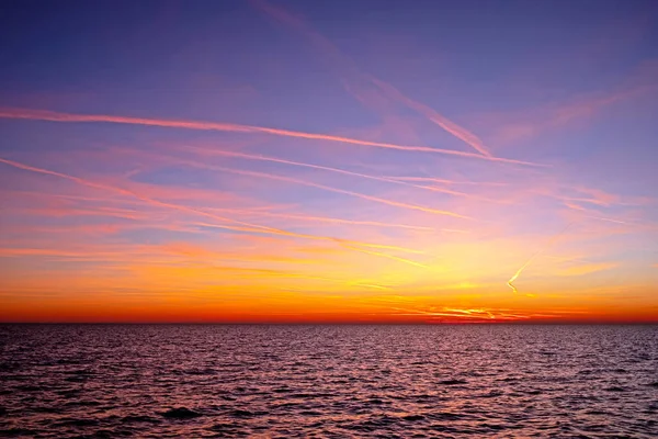 The North Sea and a beautiful sky in the Netherlands at sunset