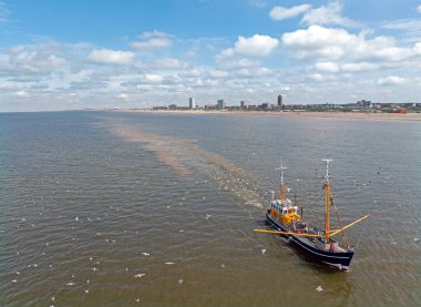 Aerial from a fishing trawler at the North Sea coast near Zandvoort in the Netherlands clipart