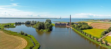 Aerial panorama from the Wouda pumping station near Lemmer in Friesland the Netherlands clipart