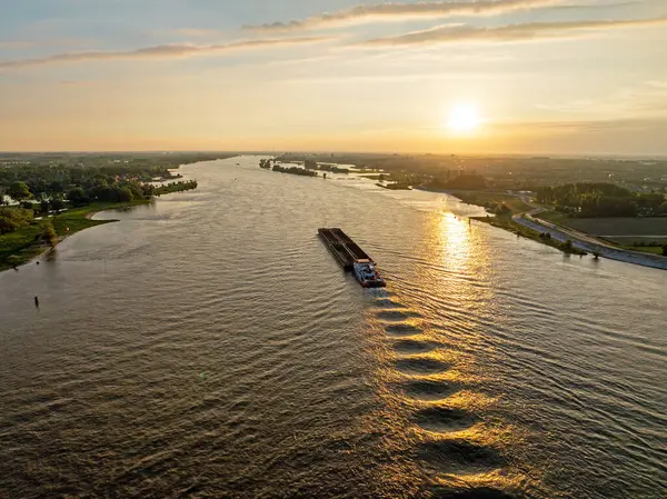 stock image Aerial from shipping on the river Merwede near Gorinchem in the Netherlands at sunset